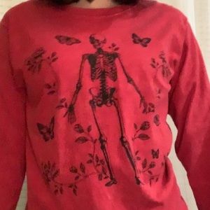 red long sleeve with a skeleton on it